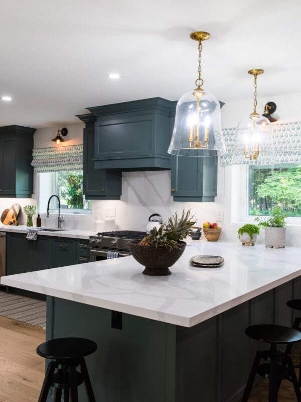 Transitional green kitchen with white quartz countertops and custom cabinetry.